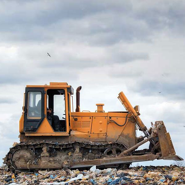 Bulldozer working in landfill Bulldozer working in landfill