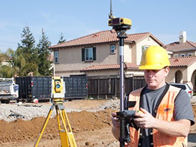 Worker using Total Station Worker using Total Station